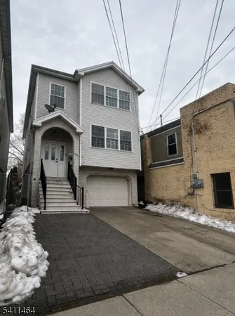 a front view of a house with a garage