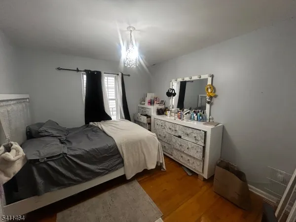 a bedroom with a bed and cabinets