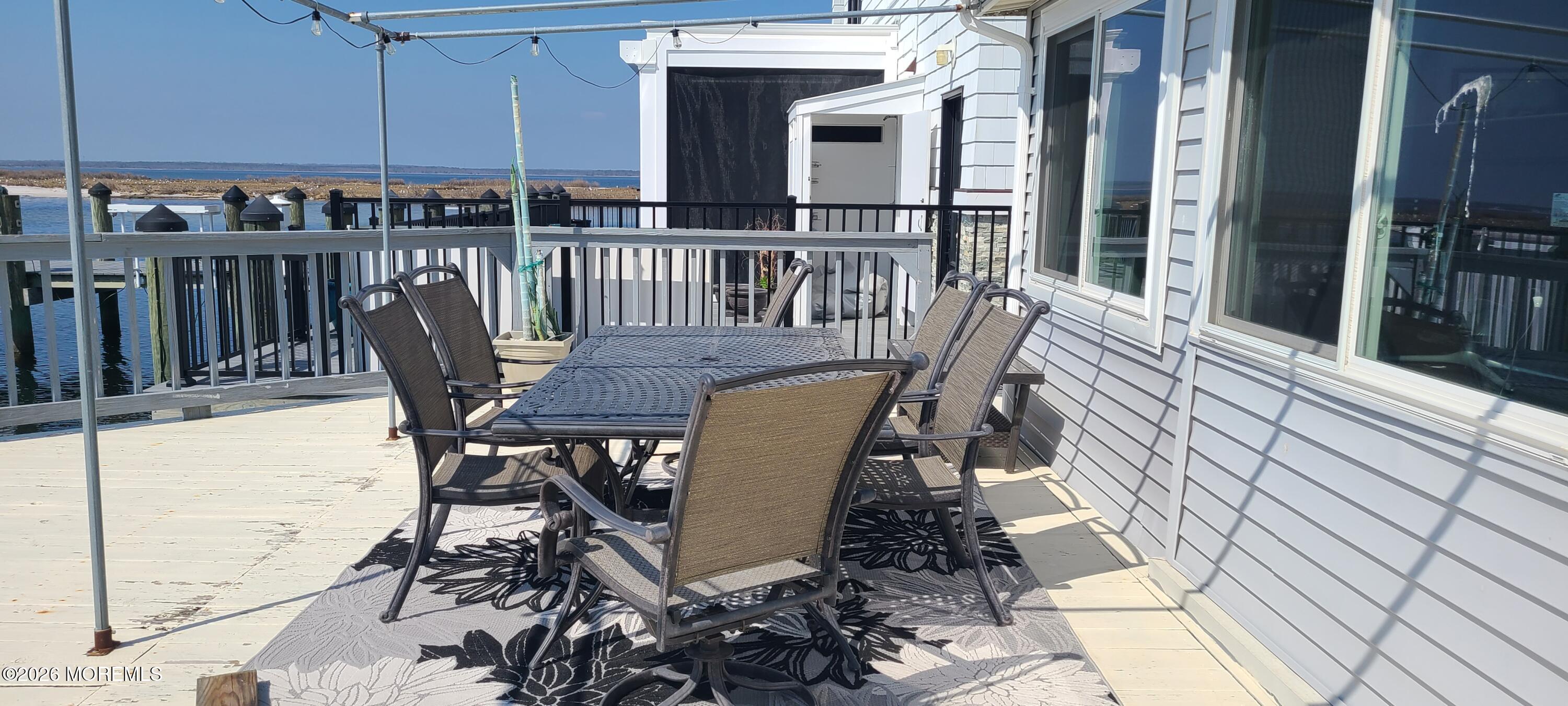 259 Joseph Street Lavallette, NJ 08735 - Photo 11 of 26 a view of a chairs and table on the balcony