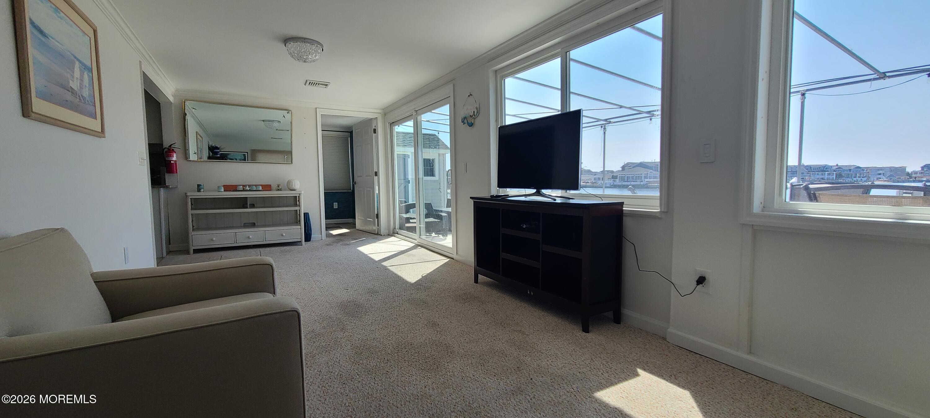 259 Joseph Street Lavallette, NJ 08735 - Photo 14 of 26 a living room with furniture and a flat screen tv