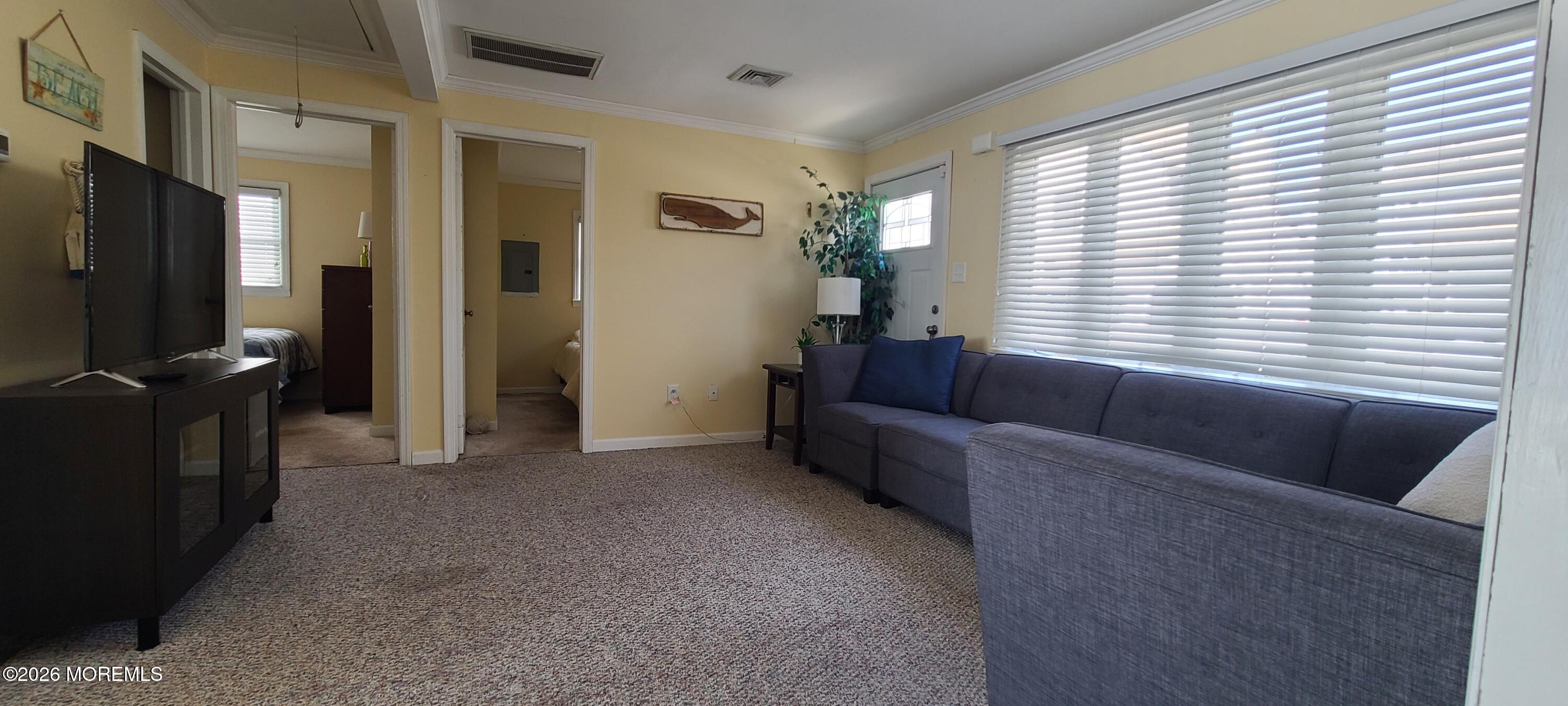 259 Joseph Street Lavallette, NJ 08735 - Photo 15 of 26 a living room with furniture and a flat screen tv