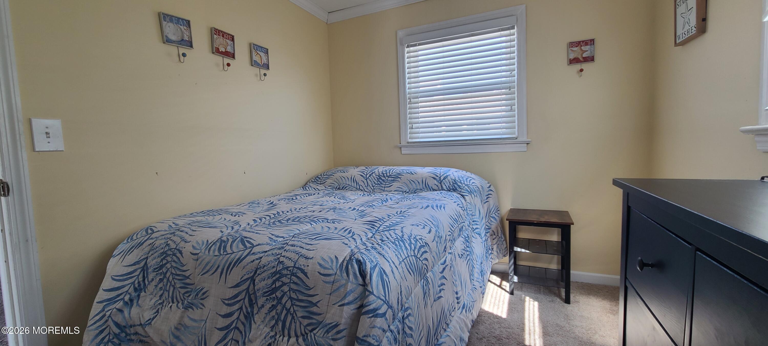 259 Joseph Street Lavallette, NJ 08735 - Photo 16 of 26 a bedroom with a bed and a window