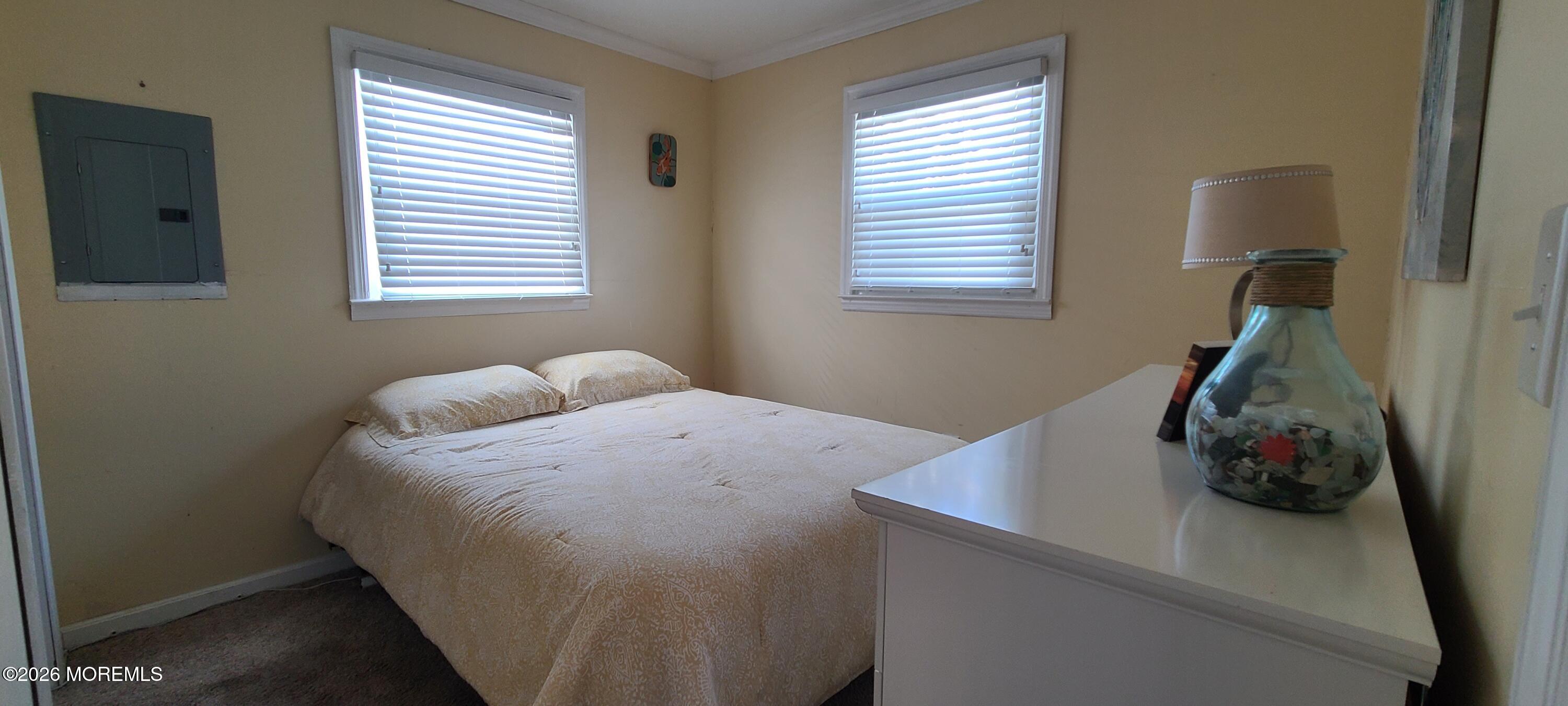 259 Joseph Street Lavallette, NJ 08735 - Photo 17 of 26 a bedroom with a bed and a window