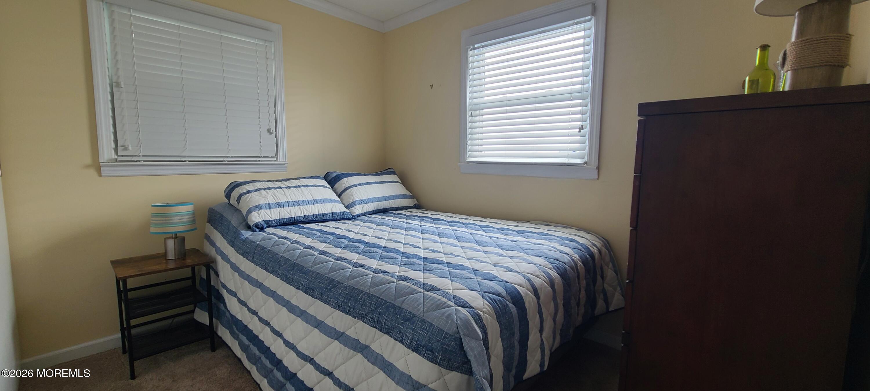 259 Joseph Street Lavallette, NJ 08735 - Photo 18 of 26 a bedroom with a bed and a window