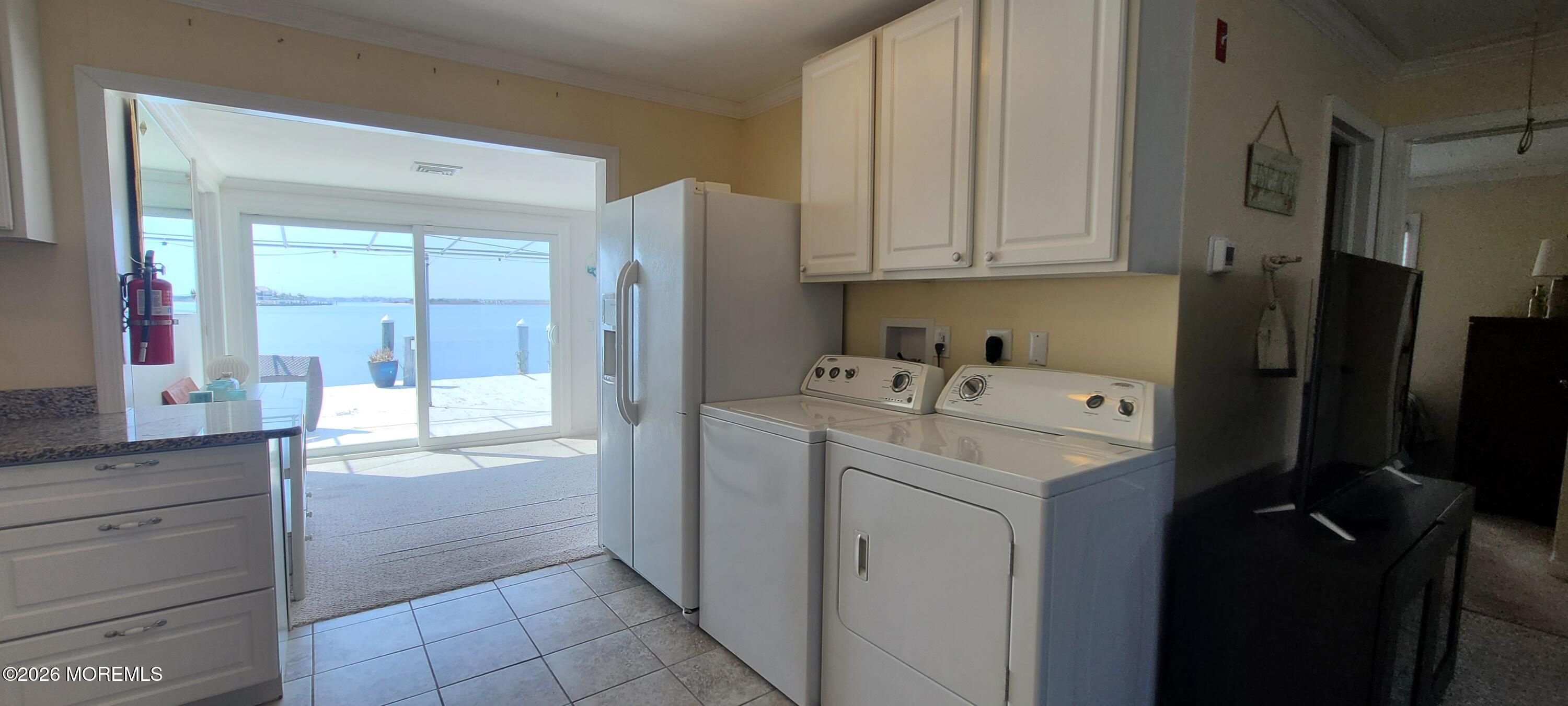 259 Joseph Street Lavallette, NJ 08735 - Photo 20 of 26 a utility room with cabinets washer and dryer