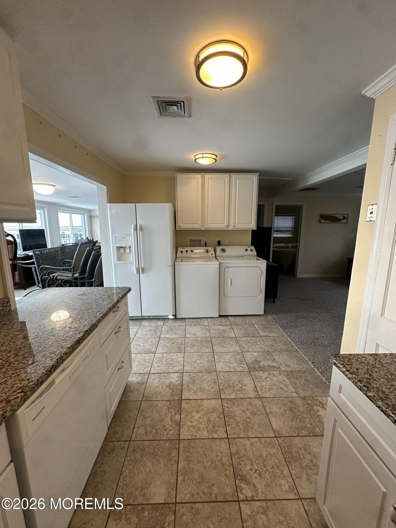 259 Joseph Street Lavallette, NJ 08735 - Photo 22 of 26 a large kitchen with a stove a sink dishwasher and a refrigerator