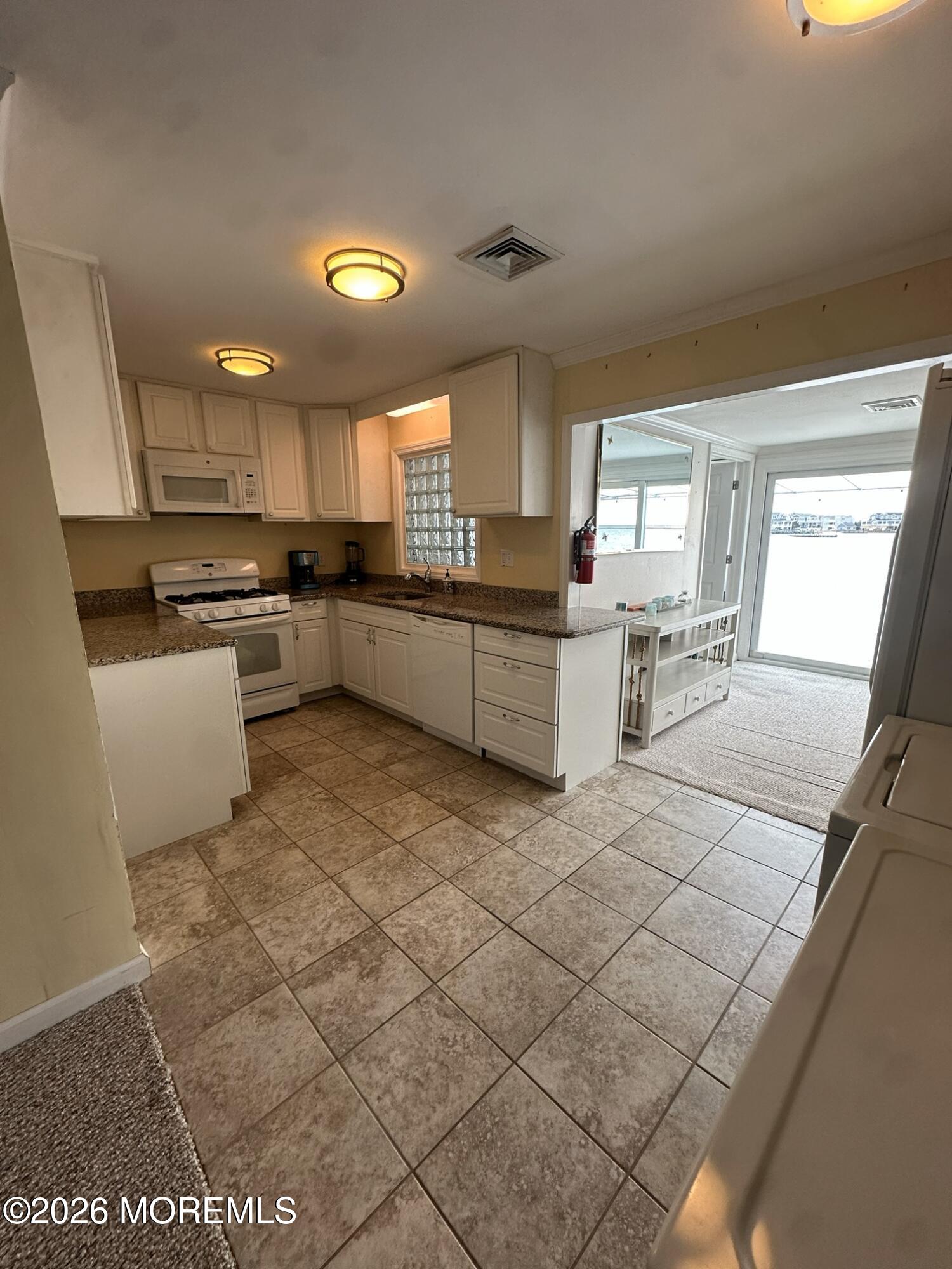 259 Joseph Street Lavallette, NJ 08735 - Photo 3 of 13 a kitchen with a sink cabinets and window