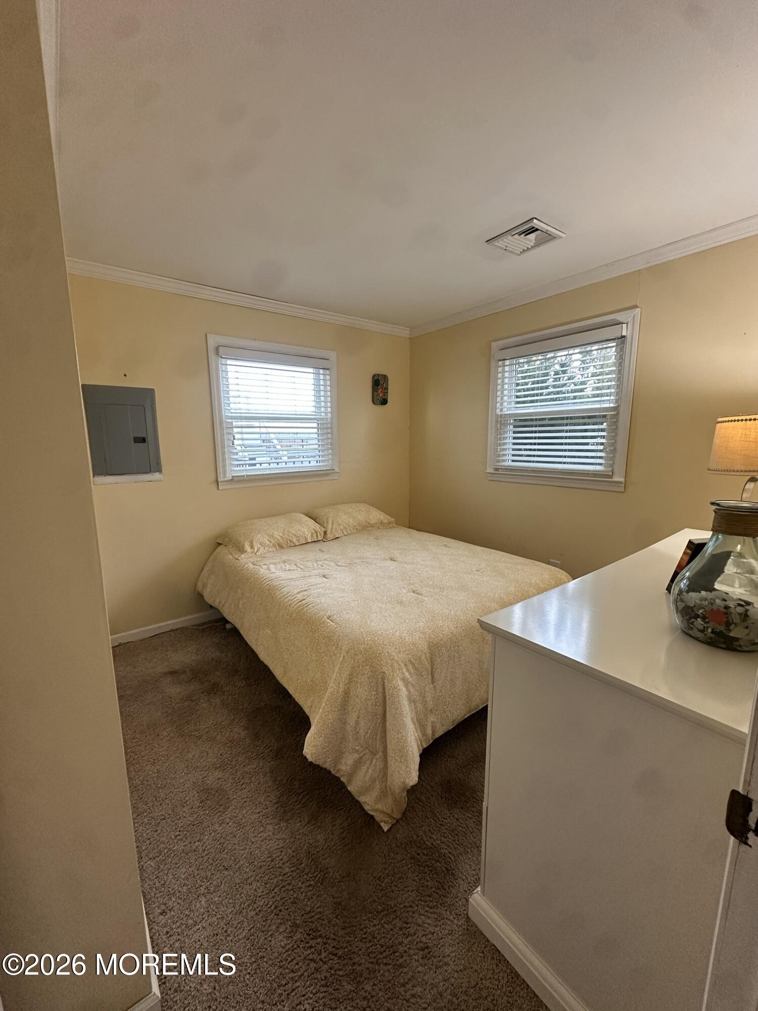 259 Joseph Street Lavallette, NJ 08735 - Photo 6 of 13 a spacious bedroom with a bed and window