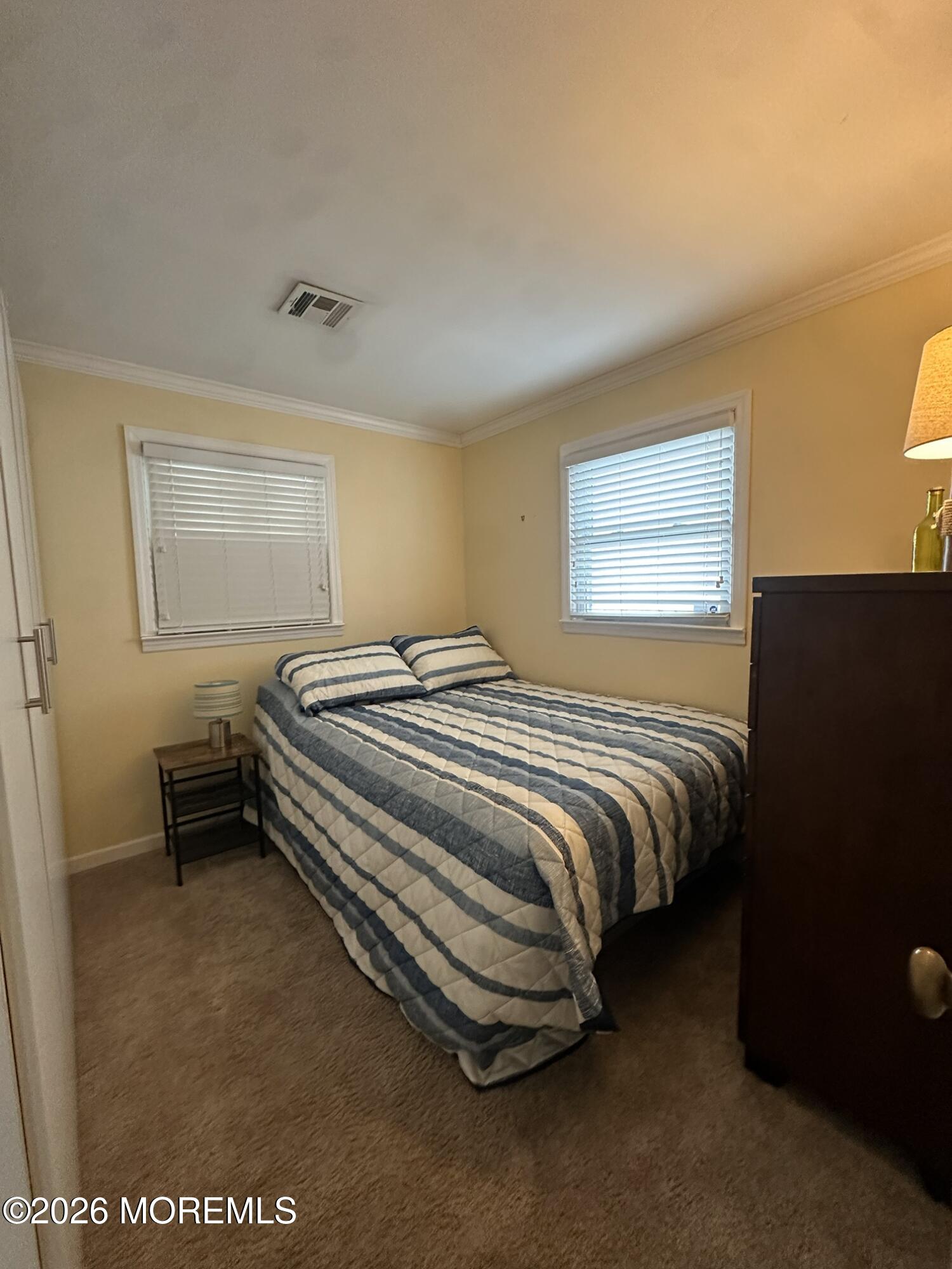259 Joseph Street Lavallette, NJ 08735 - Photo 7 of 13 a bedroom with a bed and wooden floor