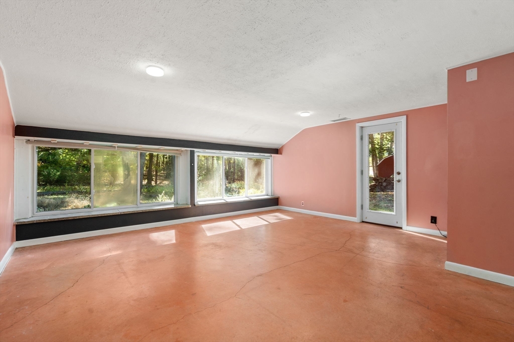 60 Baker Bridge Road Lincoln, MA 01773 - Photo 17 of 38 a view of an empty room with a window