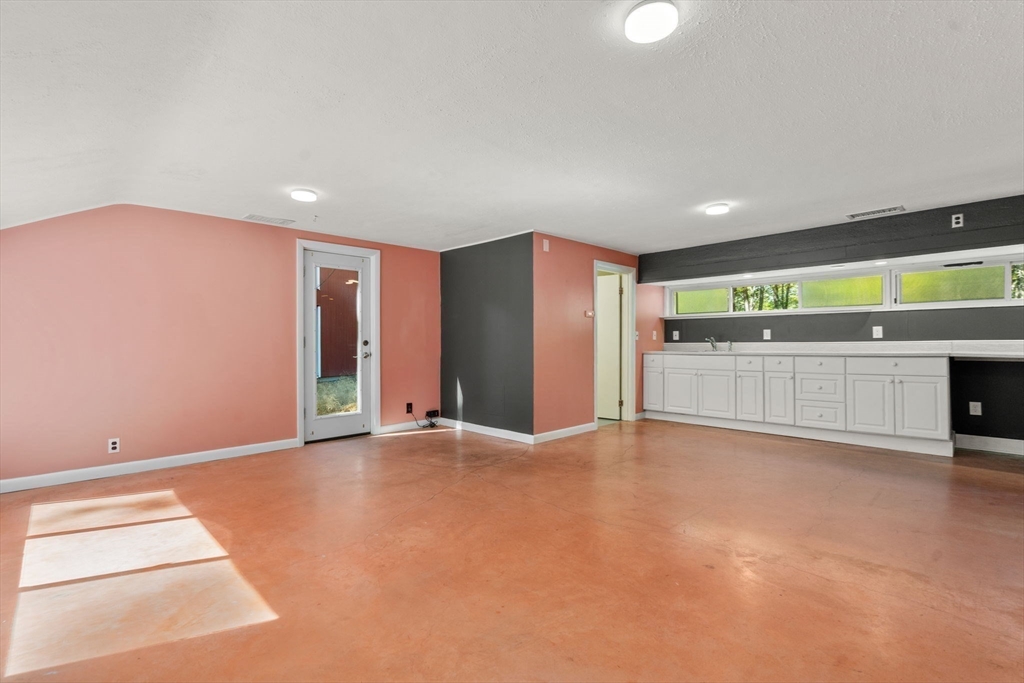 60 Baker Bridge Road Lincoln, MA 01773 - Photo 18 of 38 a view of an empty room with a window