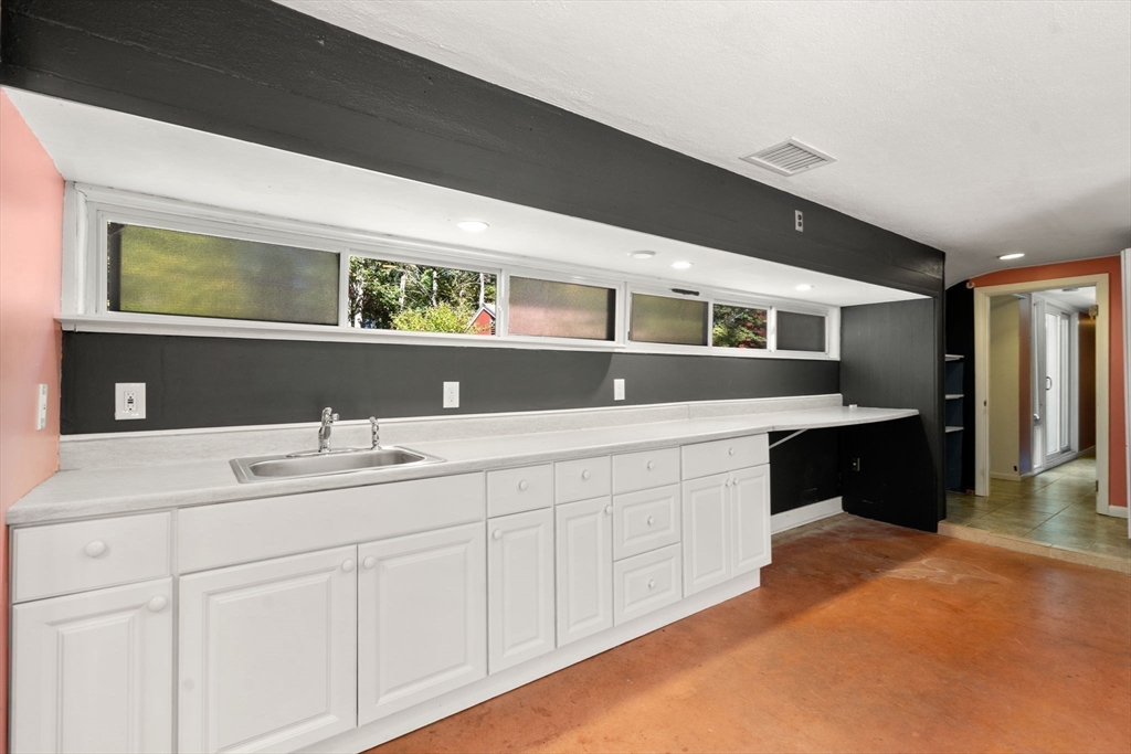 60 Baker Bridge Road Lincoln, MA 01773 - Photo 19 of 38 a spacious bathroom with a double vanity sink and a mirror