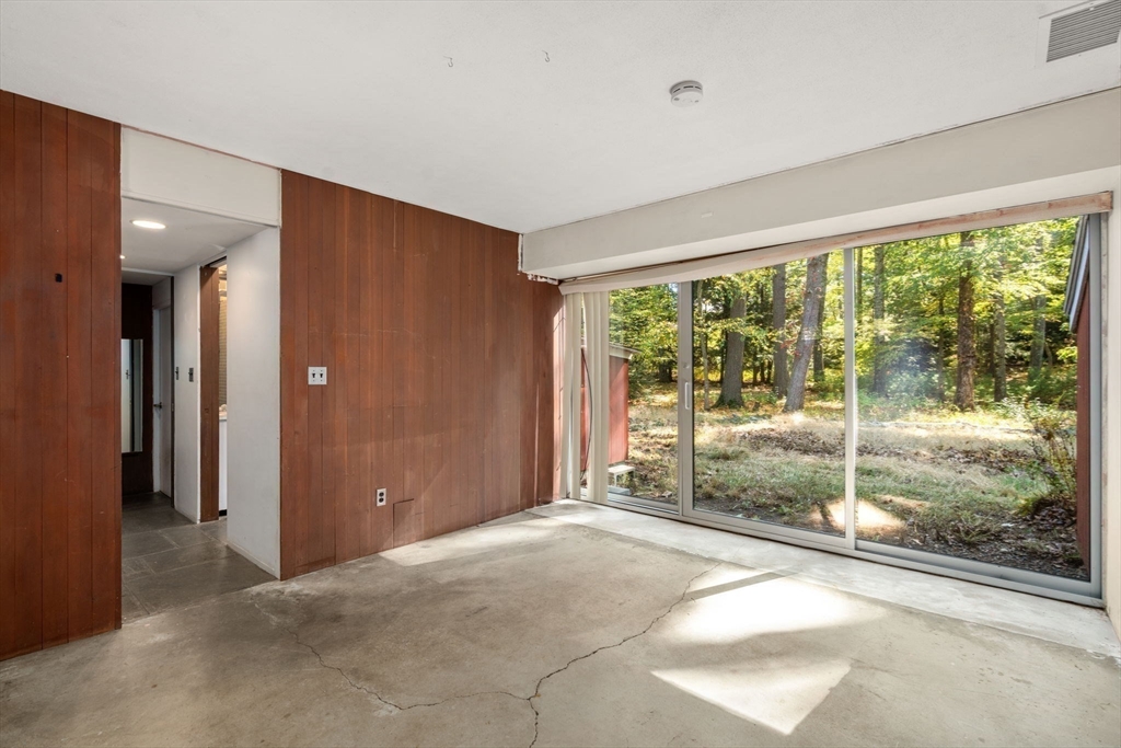 60 Baker Bridge Road Lincoln, MA 01773 - Photo 20 of 38 a view of a room with sliding glass door and mountain view