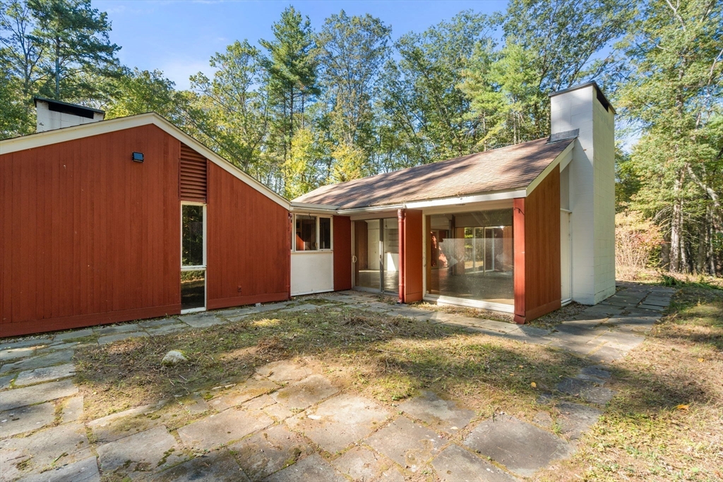 60 Baker Bridge Road Lincoln, MA 01773 - Photo 2 of 38 a view of a house with a yard and large tree
