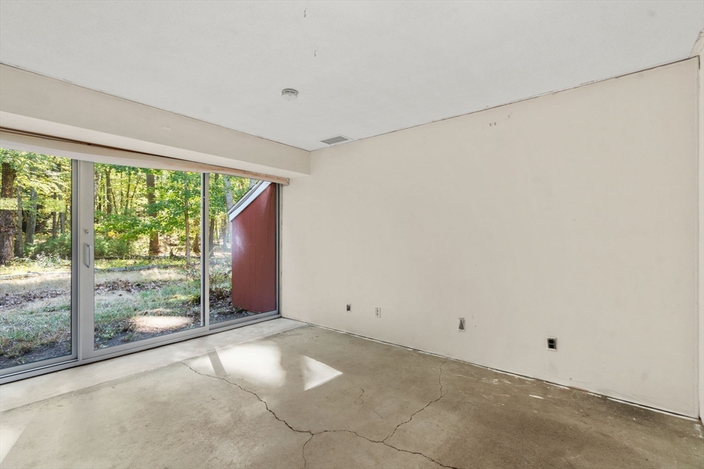 60 Baker Bridge Road Lincoln, MA 01773 - Photo 21 of 38 a view of a big room with windows and yard