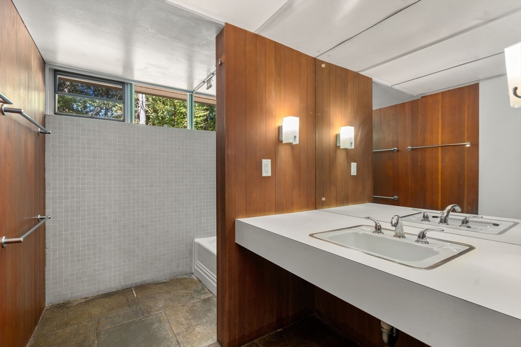 60 Baker Bridge Road Lincoln, MA 01773 - Photo 25 of 38 a bathroom with a sink and a mirror