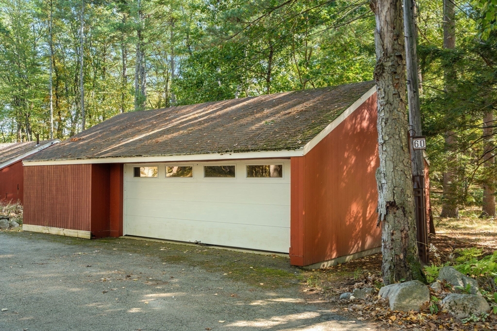 60 Baker Bridge Road Lincoln, MA 01773 - Photo 27 of 38 a house with trees in front of it