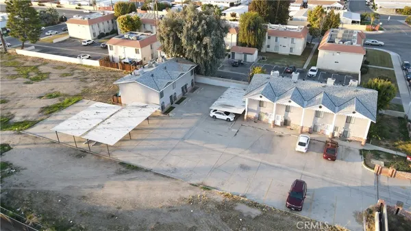 an aerial view of residential houses with outdoor space