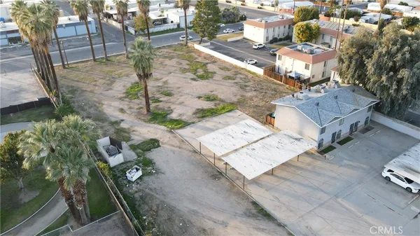 an aerial view of a house with a yard basket ball court
