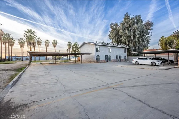 a view of a cars park in front of house