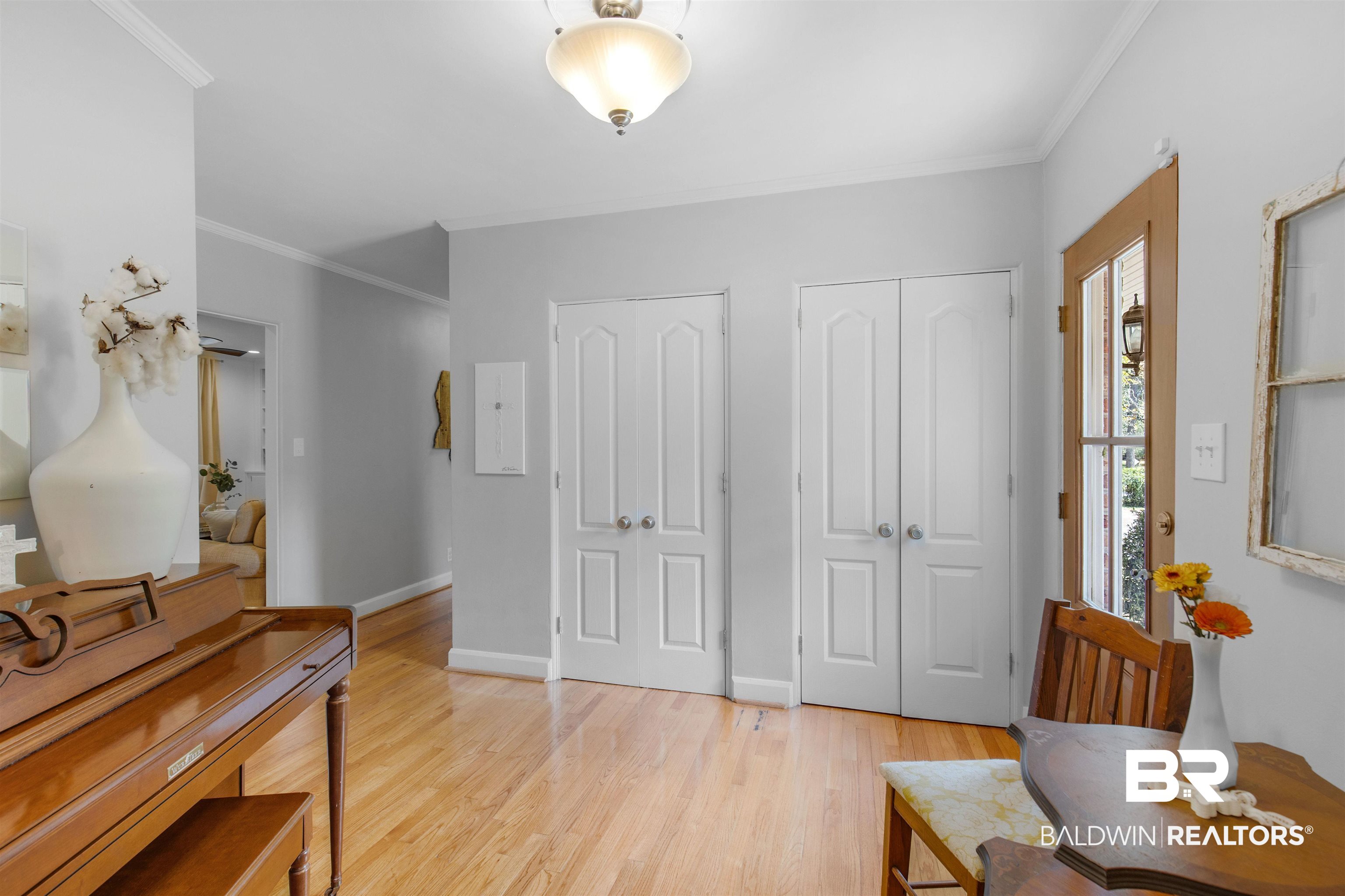 4306 Michael Boulevard Mobile, AL 36609 - Photo 2 of 35 Foyer entrance featuring light wood-type flooring and ornamental molding