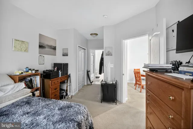 a bedroom with a bed and a chair