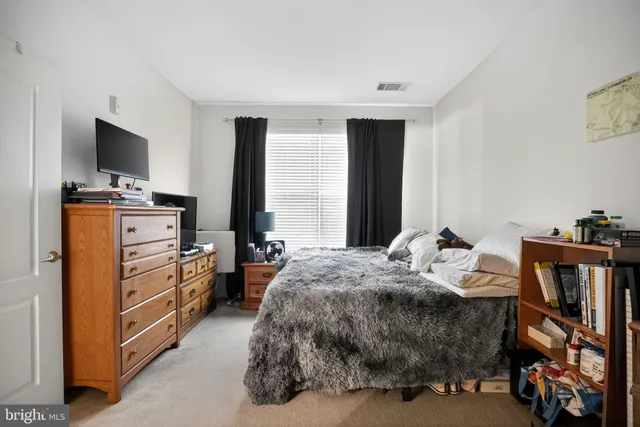 a bathroom with a double vanity sink toilet and mirror