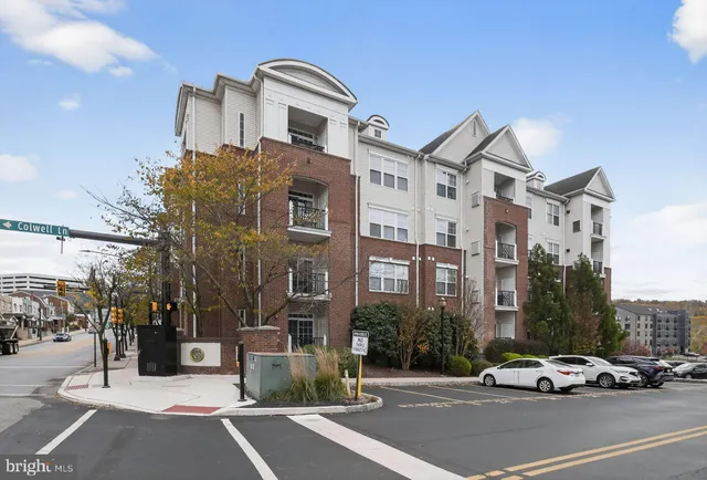 a view of a chairs and table in the balcony
