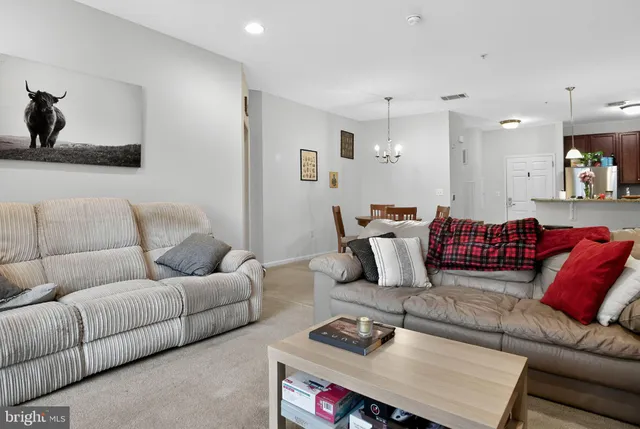 a kitchen with stainless steel appliances granite countertop a refrigerator stove and sink