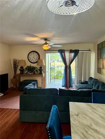 a living room with furniture and a large window