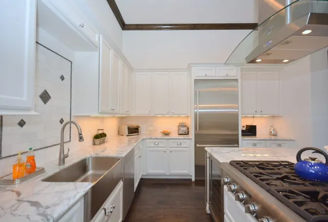 a view of a dining room with furniture and a window