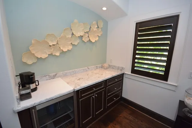 a large bedroom with a bed and lamp with window