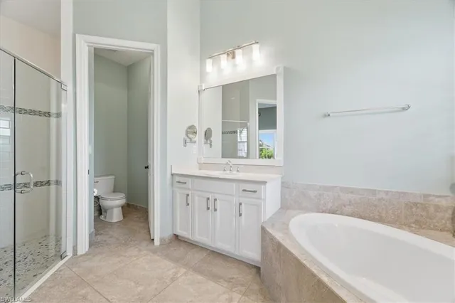 a bathroom with a bathtub sink and toilet