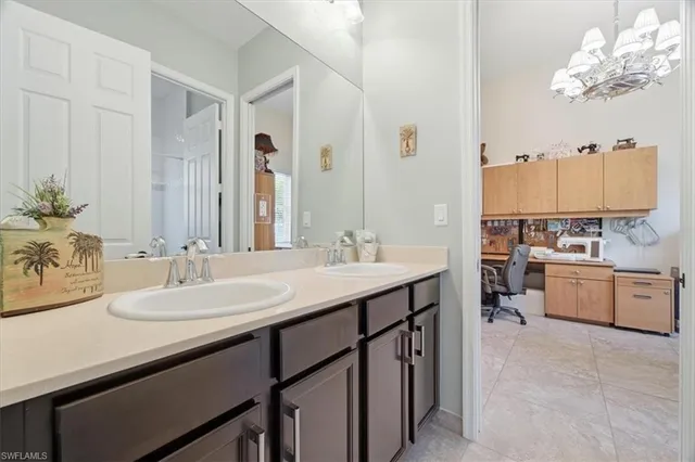a bathroom with a sink double vanity and a mirror