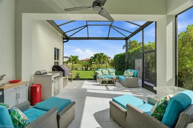 a living room with furniture a chandelier and a couch