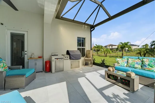 a balcony with furniture and potted plants
