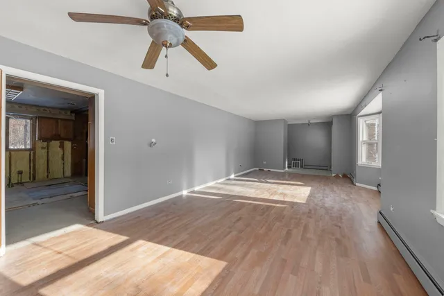a bathroom with a toilet a sink and glass door