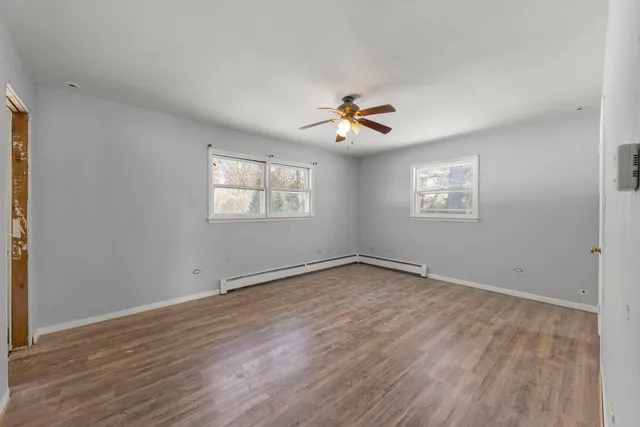 a bathroom with a shower and a toilet