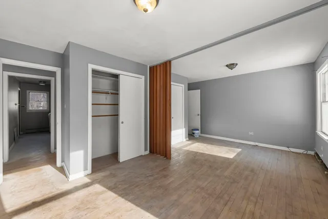 a view of room with a ceiling fan and window