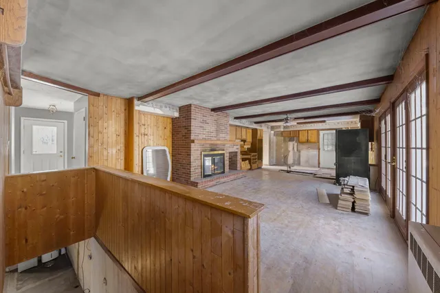a room with natural light and wooden floor