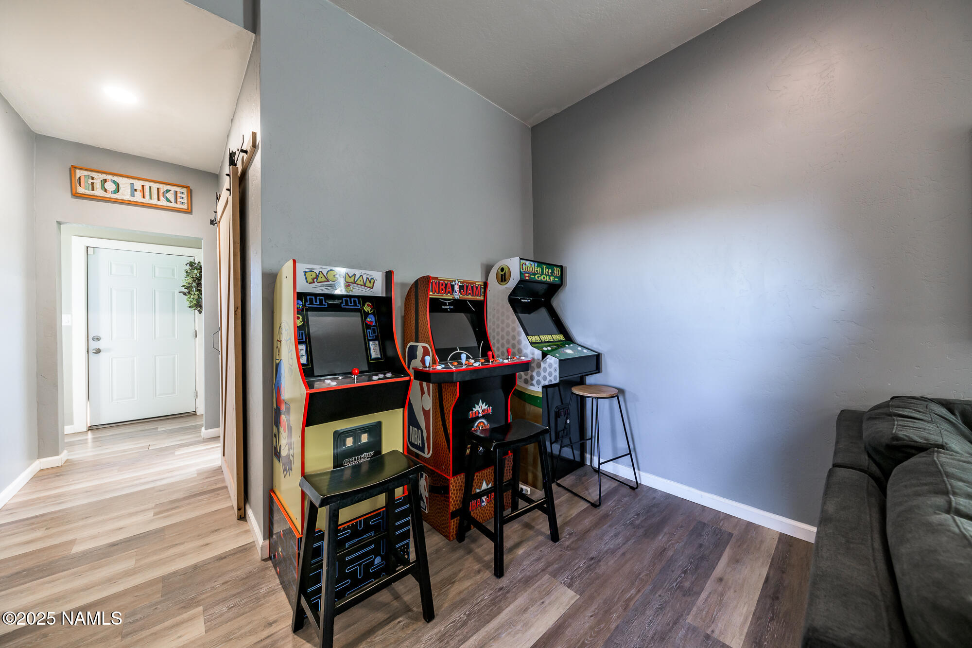 224 East San Marcos Road Williams, AZ 86046 - Photo 15 of 58 a view of a workspace with furniture and wooden floor