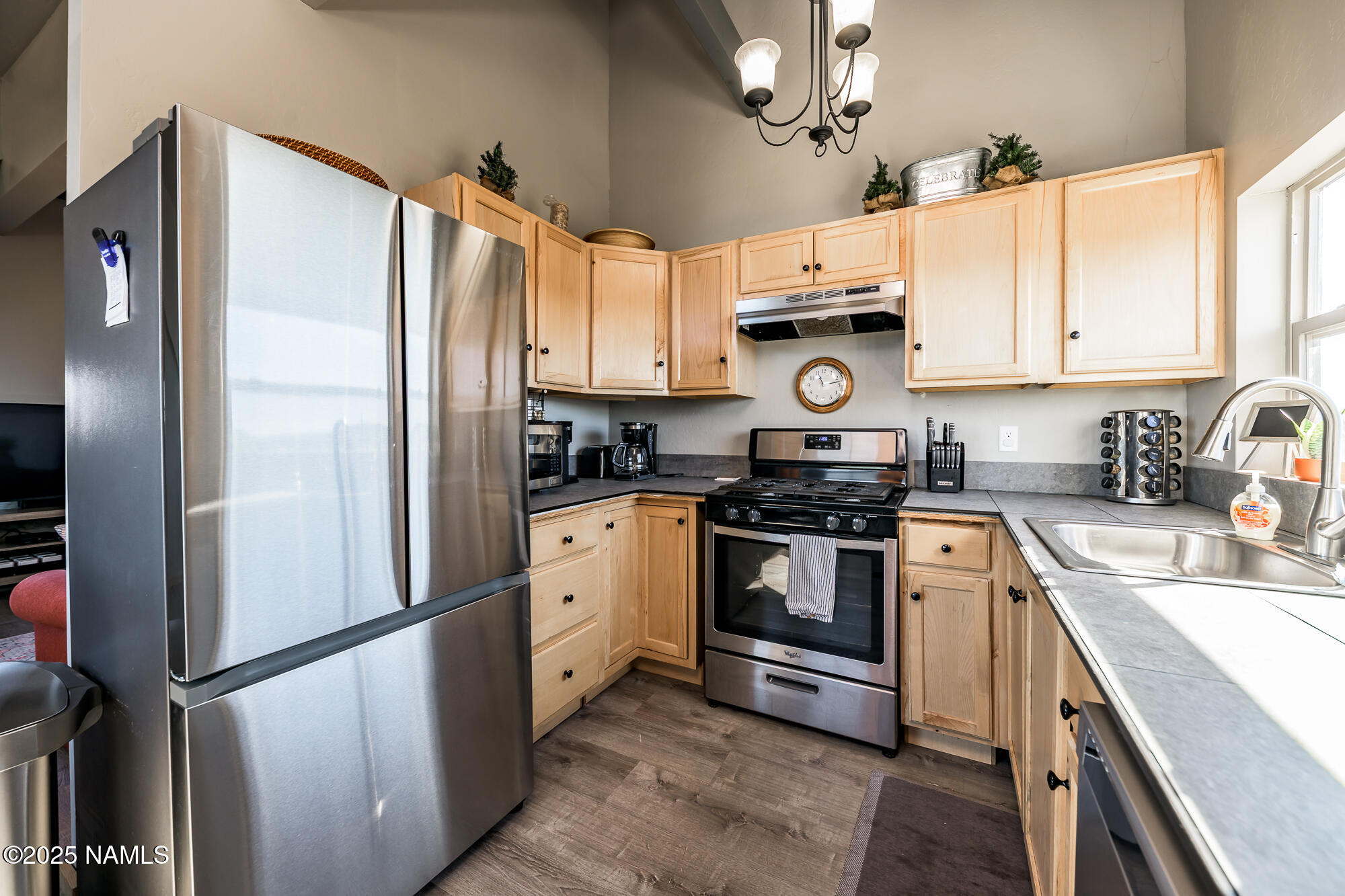 224 East San Marcos Road Williams, AZ 86046 - Photo 19 of 58 a kitchen with stainless steel appliances a refrigerator sink and microwave