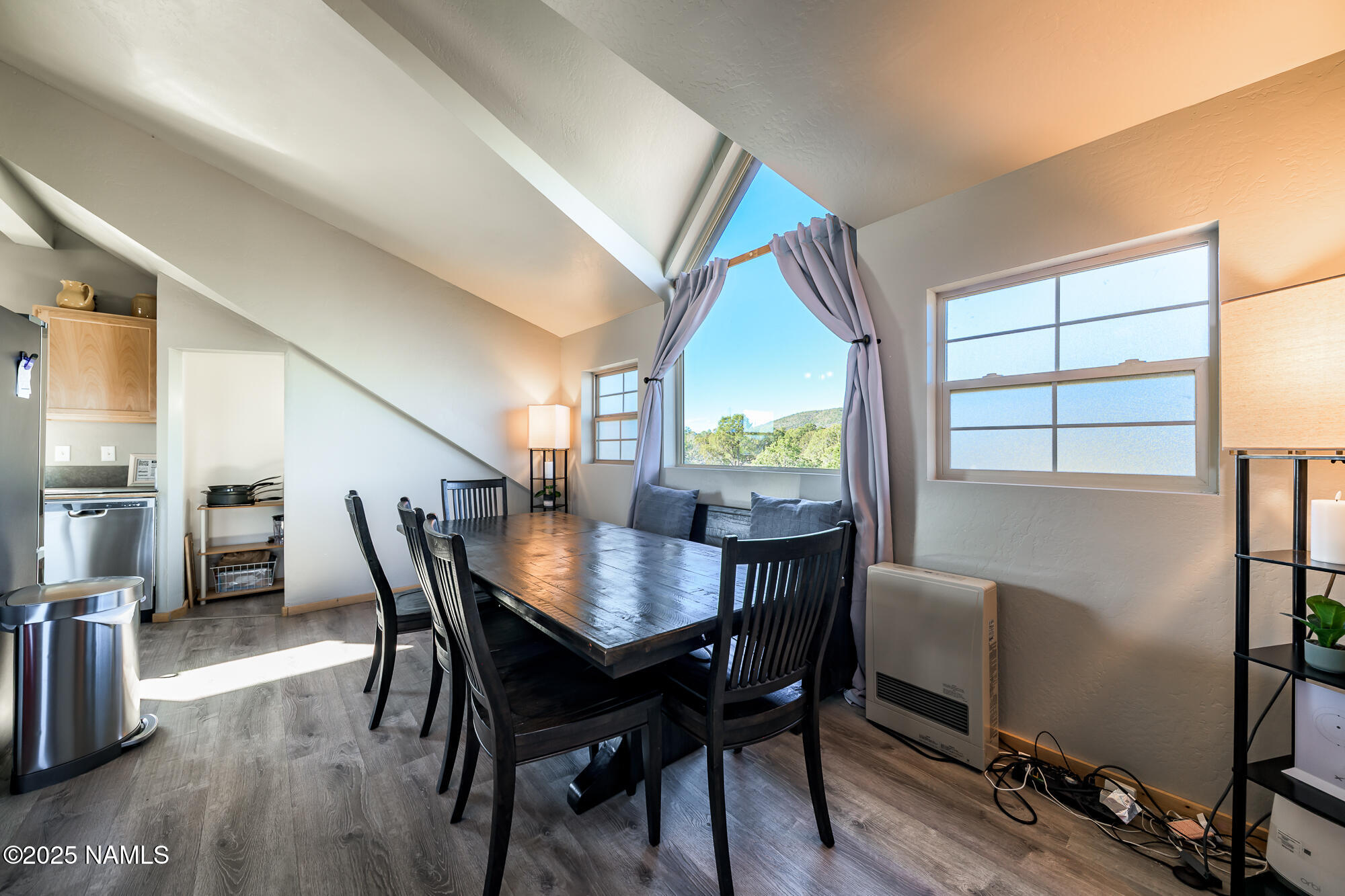 224 East San Marcos Road Williams, AZ 86046 - Photo 23 of 58 a view of a dining room with furniture and a window