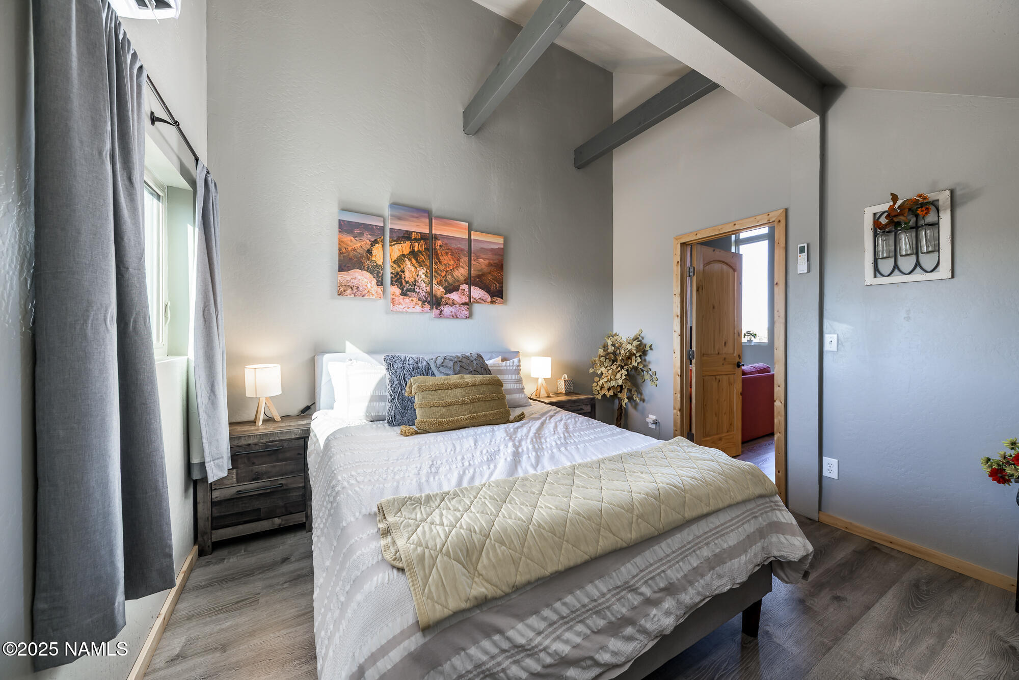 224 East San Marcos Road Williams, AZ 86046 - Photo 24 of 58 a bedroom with a bed and painting on the wall