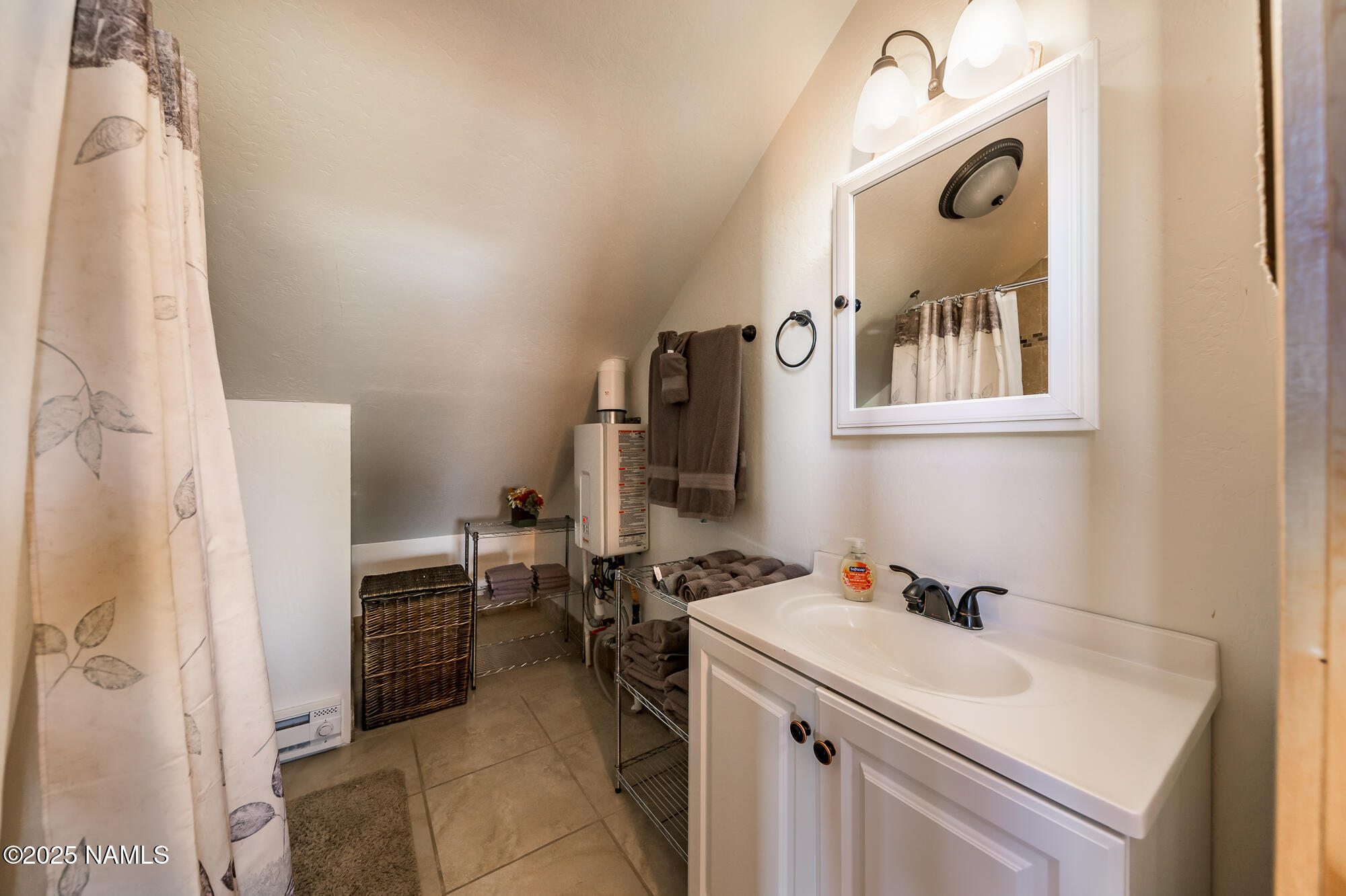 224 East San Marcos Road Williams, AZ 86046 - Photo 37 of 58 a bathroom with a sink and a mirror