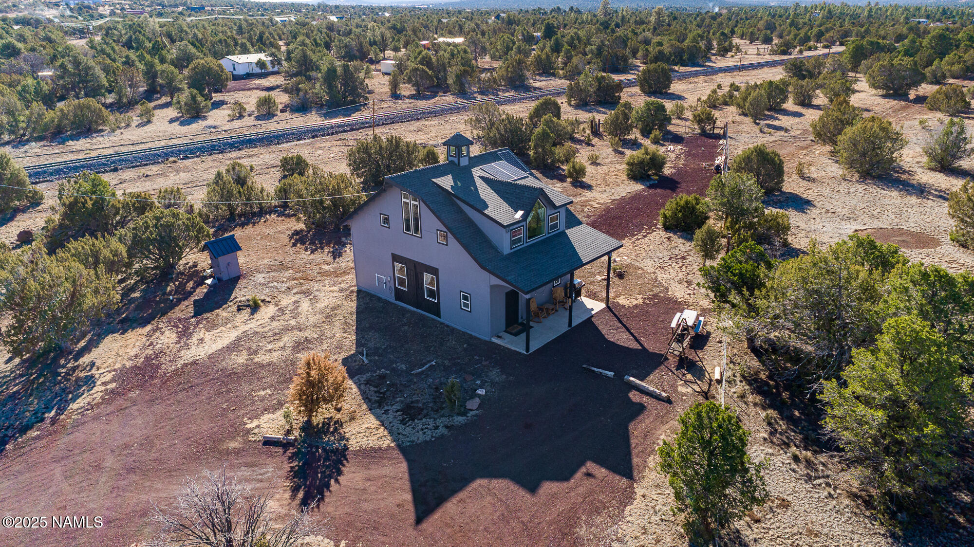 224 East San Marcos Road Williams, AZ 86046 - Photo 41 of 58 an aerial view of a house with a garden and lake view