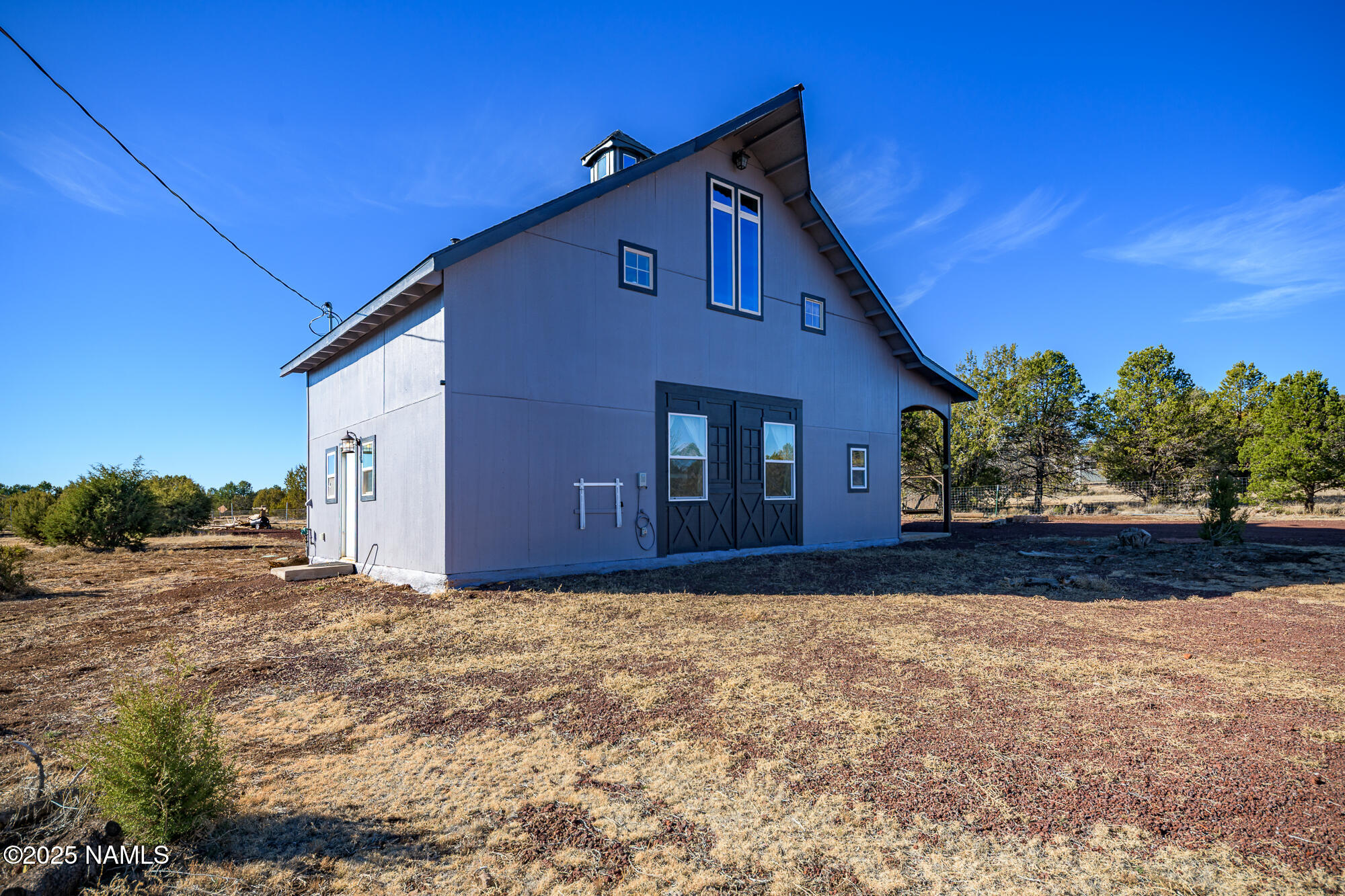 224 East San Marcos Road Williams, AZ 86046 - Photo 47 of 58 a front view of a house with a yard