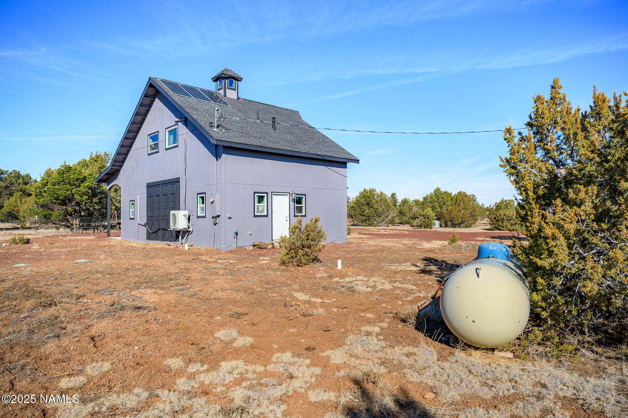 224 East San Marcos Road Williams, AZ 86046 - Photo 48 of 58 a view of a house with a backyard