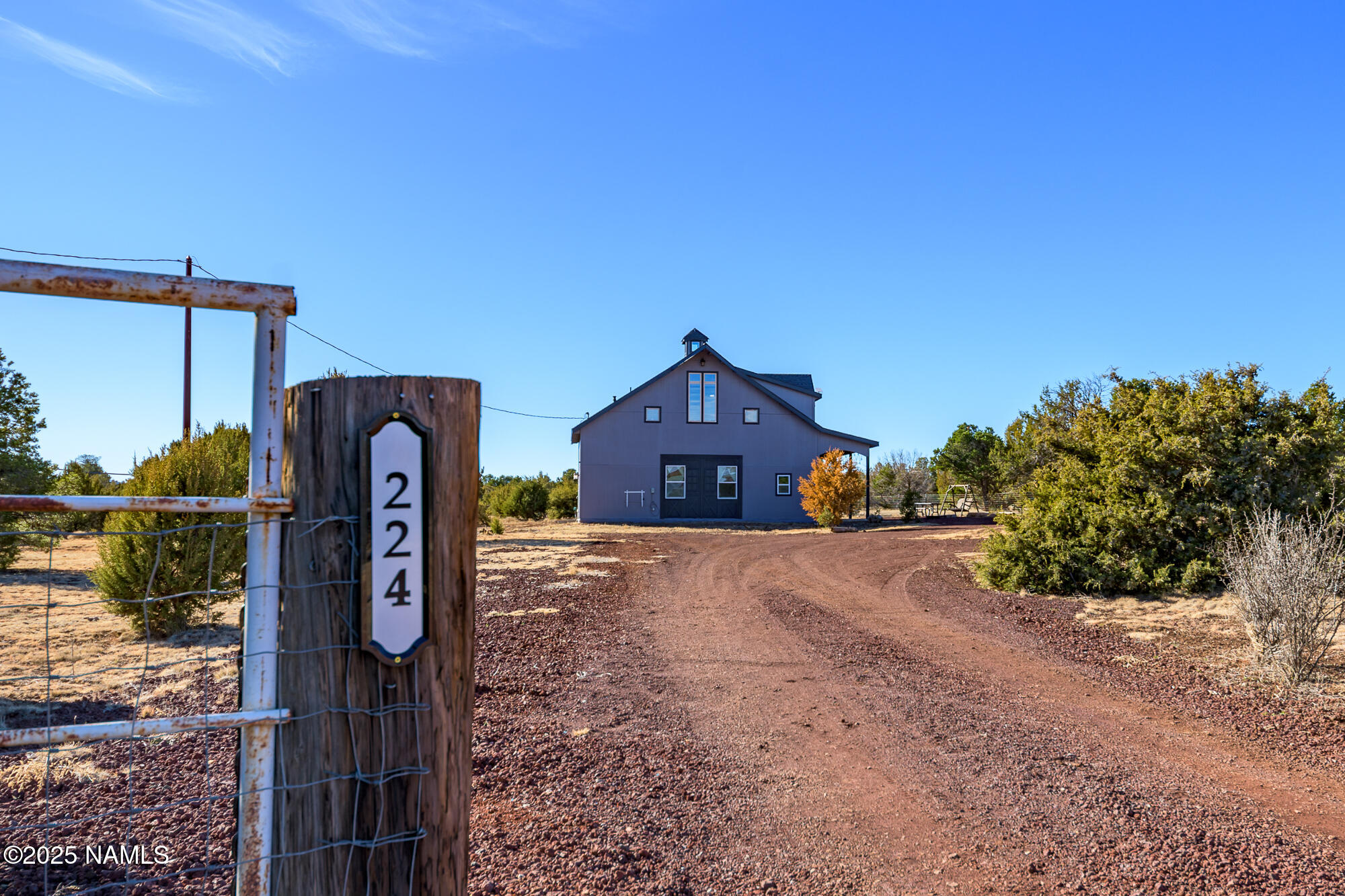 224 East San Marcos Road Williams, AZ 86046 - Photo 6 of 58 a front view of a house with a yard