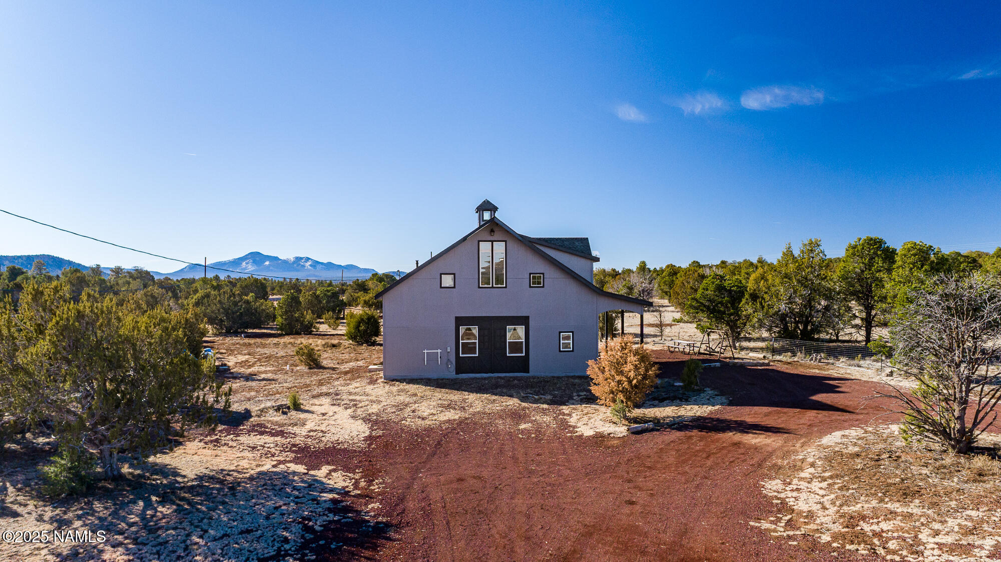 224 East San Marcos Road Williams, AZ 86046 - Photo 7 of 58 a front view of a house with a yard